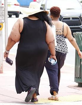 Two obese black women walking